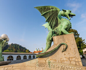 Dragon statue on Dragon Bridge in Ljubljana at sunrise