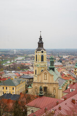 Fototapeta premium Przemyśl, Subcarpathian, Poland, 30 March 2025: Przemyśl Cathedral with its clock tower and a view of the old town
