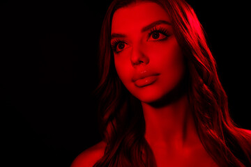 Portrait of attractive tender young lady looking empty space model isolated multicolor disco red...