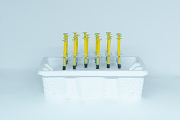 Syringes ready for vaccination in a cold storage room