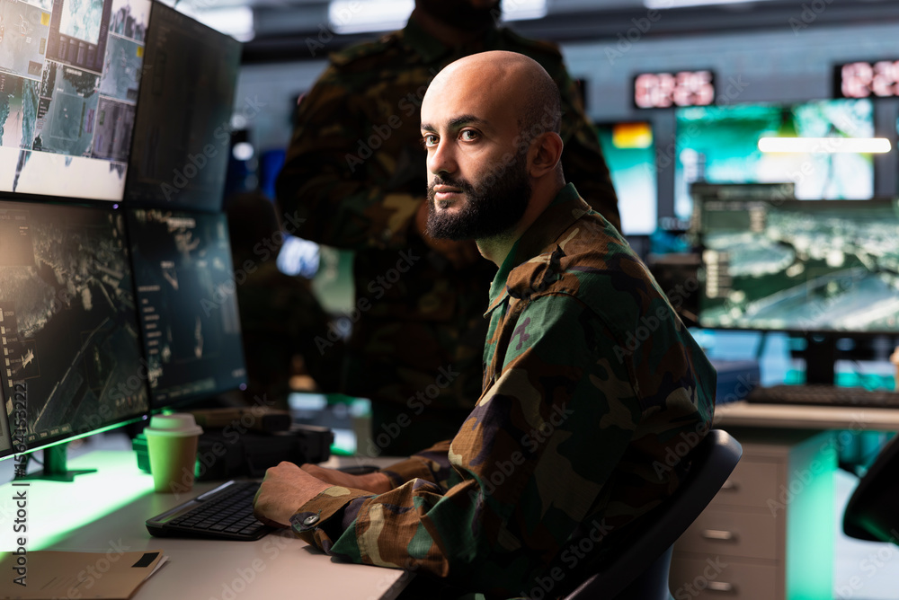 Poster intelligence corps agent working in command center housing operational missile defense system design