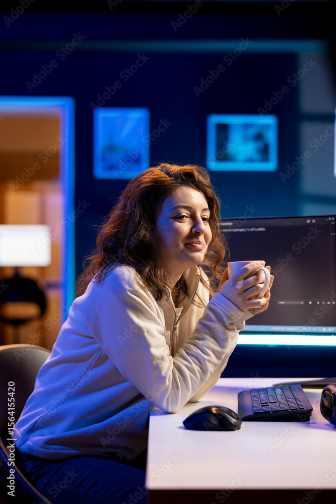 Poster smiling it admin drinking coffee while fixing vulnerabilities in software enabling hackers to compro