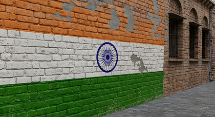 India flag graffiti on old brick wall. Urban street art background with tricolor design. Patriotism concept on grunge building exterior wallpaper