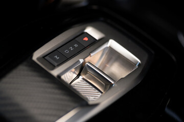  Close-up photo of the automatic gear controls on the dashboard of a modern car