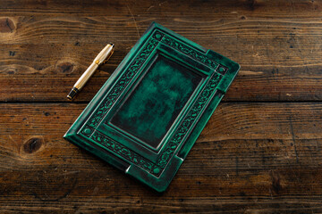 An old book in a room with other leather books