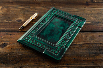 An old book in a room with other leather books