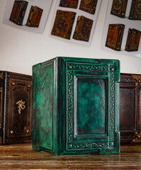 An old book in a room with other leather books