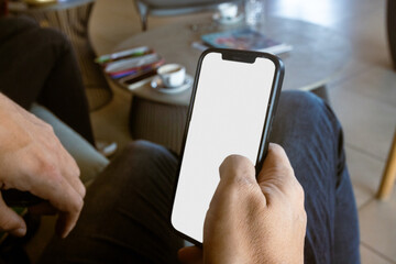 Man Using Smartphone in Modern Cafe 