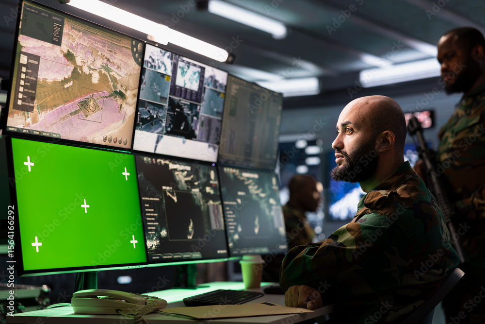Poster counterterrorism division operative using target acquisition tech on isolated screen gear to detect 