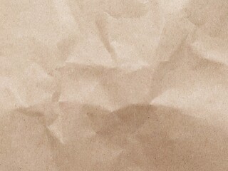 Brown crumpled paper pattern. Crumpled old brown vintage paper surface texture for background....