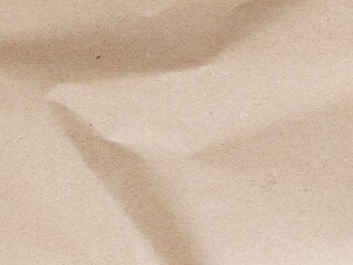 Brown crumpled paper pattern. Crumpled old brown vintage paper surface texture for background. Crumpled brown recycle paper texture. Paper board with copy space for text, space for copy.