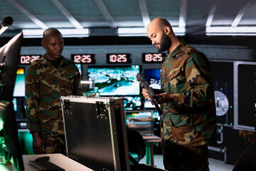 Army solders packing weapons able to engage targets at extended range with accurate, lethal fire....