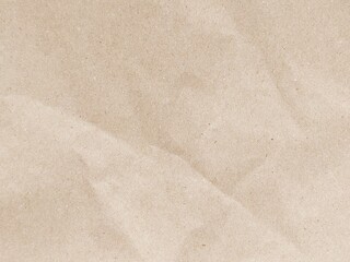 Brown crumpled paper pattern. Crumpled old brown vintage paper surface texture for background....