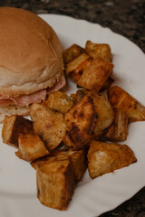 Sandwich with Roasted Potatoes on Plate