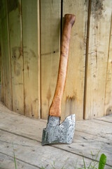 Finnish axe near wooden boards