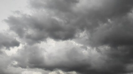 Ominous cloudscape background of gray puffy clouds on a dark and overcast windy day - Powered by Adobe