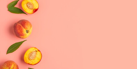 Sweet peaches and leaves on pink background