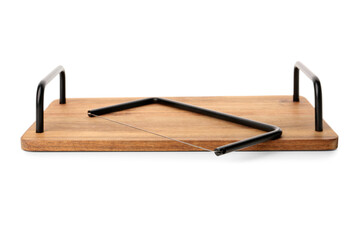 Wooden kitchen board with cheese slicer on white background