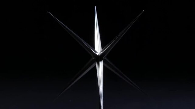 Razor Spin: A sharpened throwing star spins rapidly in black void, its steel edges catching light with lethal precision.