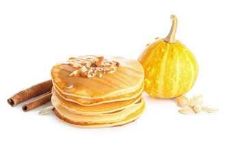 Tasty pumpkin pancakes with honey and nuts on white background