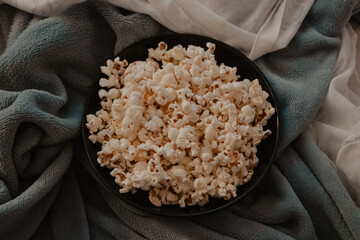 Bowl of Popcorn on a Cozy Blanket