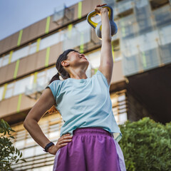 Japanese mature woman train with kettle bell do exercise for arms