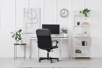 Interior of office with comfortable workplace and modern computer