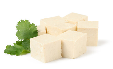 Cut tofu cheese and parsley isolated on white background, closeup