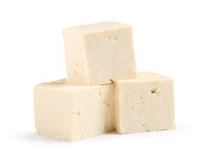 Cut tofu cheese isolated on white background, closeup