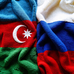 flag of azerbaijan and russia in the form of knitted background