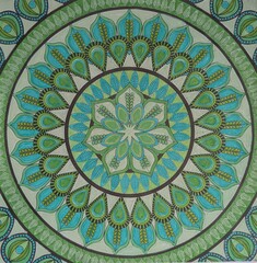 Green hand painted mandala, artistic background.