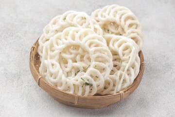 Kerupuk. Crackers or crackers are food made from flour mixture mixed with crushed shrimp or fish, after steaming they are sliced ​​thinly or shaped with a mold and dried in the sun so the