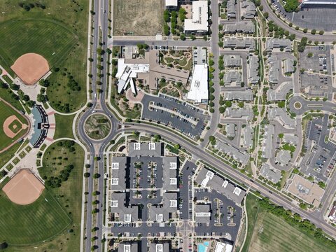 Top-down perspective highlights organized urban planning and diverse land use in Lowry, Colorado,