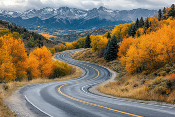 Autumnal road winding through a mountain pass