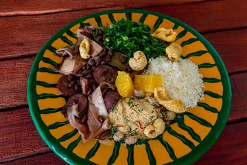 The best traditional Brazilian feijoada completely served in the most authentic style accompanied by the irresistible and iconic cachaça caipirinha