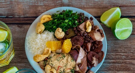 The best traditional Brazilian feijoada completely served in the most authentic style accompanied by the irresistible and iconic cachaça caipirinha
