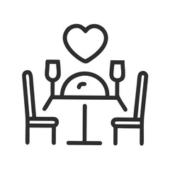 Romantic dinner table for two with heart symbol chairs wine glasses
