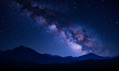 Fototapeta premium A Breathtaking View of the Milky Way Galaxy in a Deep Blue and Purple Night Sky