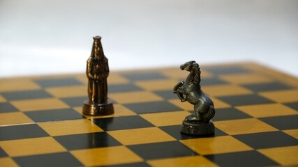 Chess pieces on the chessboard. Chess Game. Close Up Playing a Game of Chess. Strategy game that...