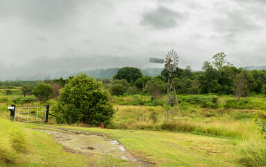 Landscape scene of a eco friendly  windmill water pump