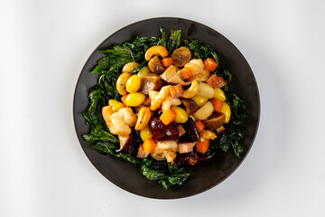 Stir fried mixed Chinese fruits and nuts  on a white background