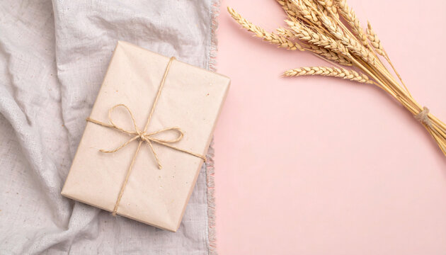 A simply wrapped gift box on a light surface, showcasing rustic elegance and understated charm.
