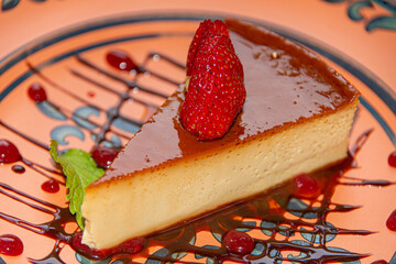 Napolitan Flan with Strawberry on Clay Plate in Colonial Restaurant