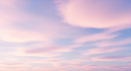 Naklejka premium Serene Pastel Clouds Adorning a Soft Blue Sky at Dawn or Dusk