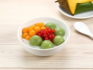 Colorful Asian Dessert Bowl on Wood Table