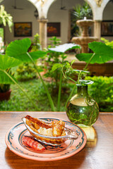 Flambéed Banana with Vanilla Ice Cream on Glass Plate in Colonial Restaurant