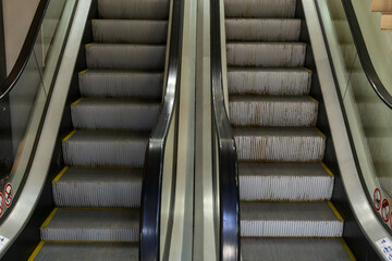 Symmetrical Escalator Steps Ascending Towards Progress And Success. Urban Escalator In Motion...