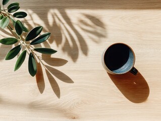 Modern Minimal Workspace with Coffee and Greenery from Top View