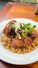 Fried chicken wings served with fried rice / cooking fried chicken wings concept