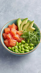 Salmon, avocado, edamame, sesame, and fresh greens in bowl create healthy, vibrant, and appetizing poke bowl meal
